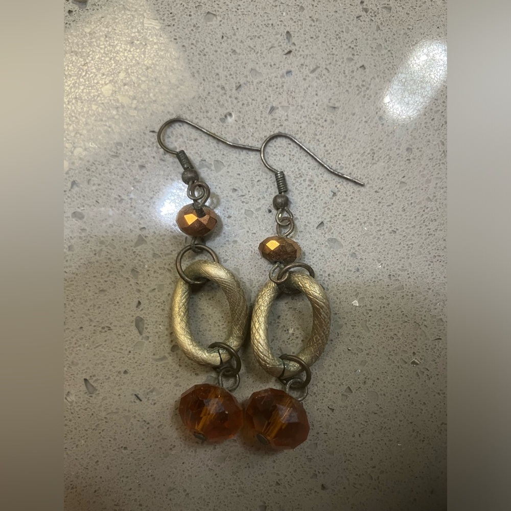 Fake gold dangling earrings with brown beads